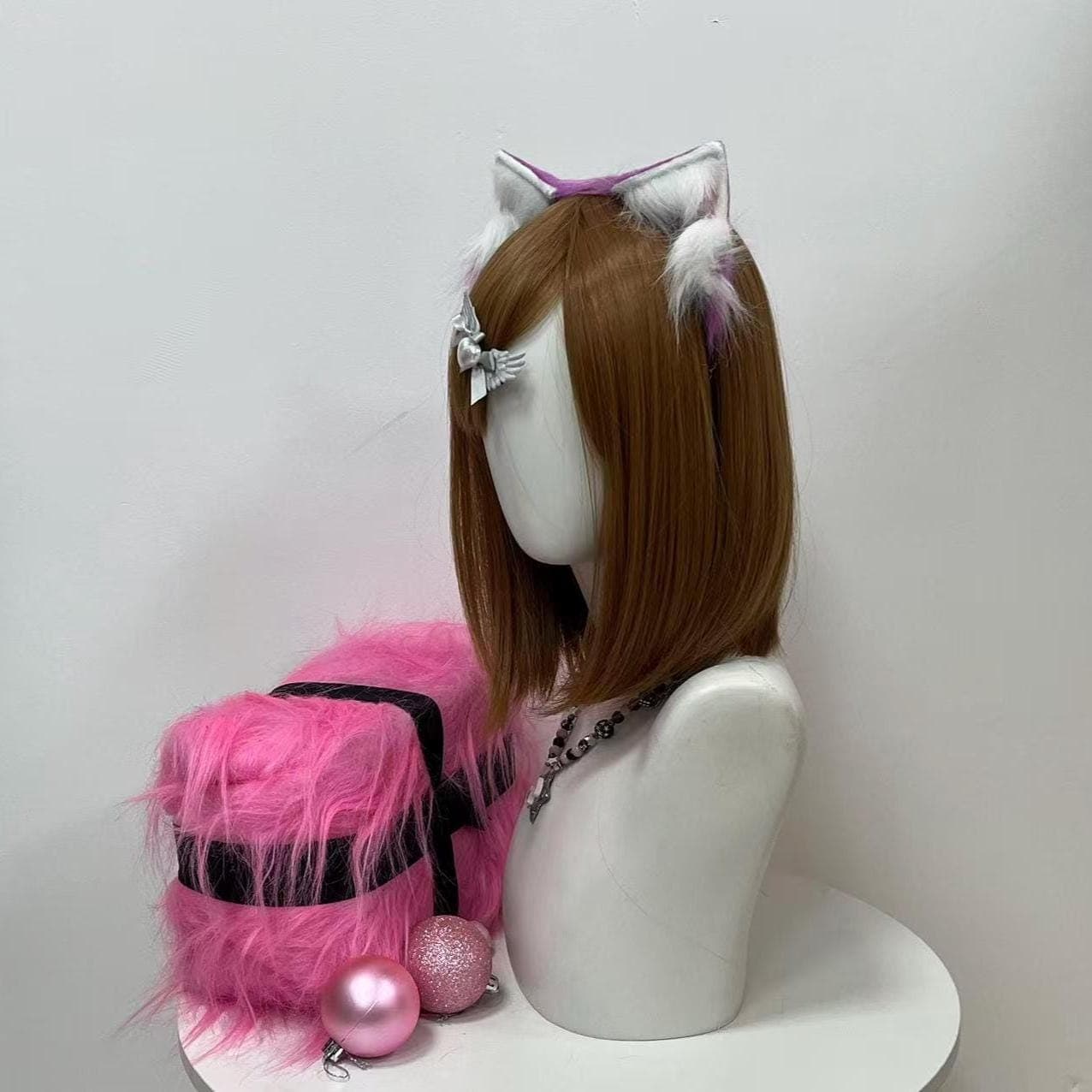 Side profile reveal of the costal wolf ears headband, showing off the full ear depth from wide base to pointed tip with silky snow white inner fluff fading gently into a lilac purple crown. Handmade faux fur construction keeps the sculpt believable from every camera angle, ideal for photographers chasing clean con portrait shots. Grab these for timberwolf OC reveals, festival ears sets, furry fursona runs, LARP encounters or therian outdoor day hikes.