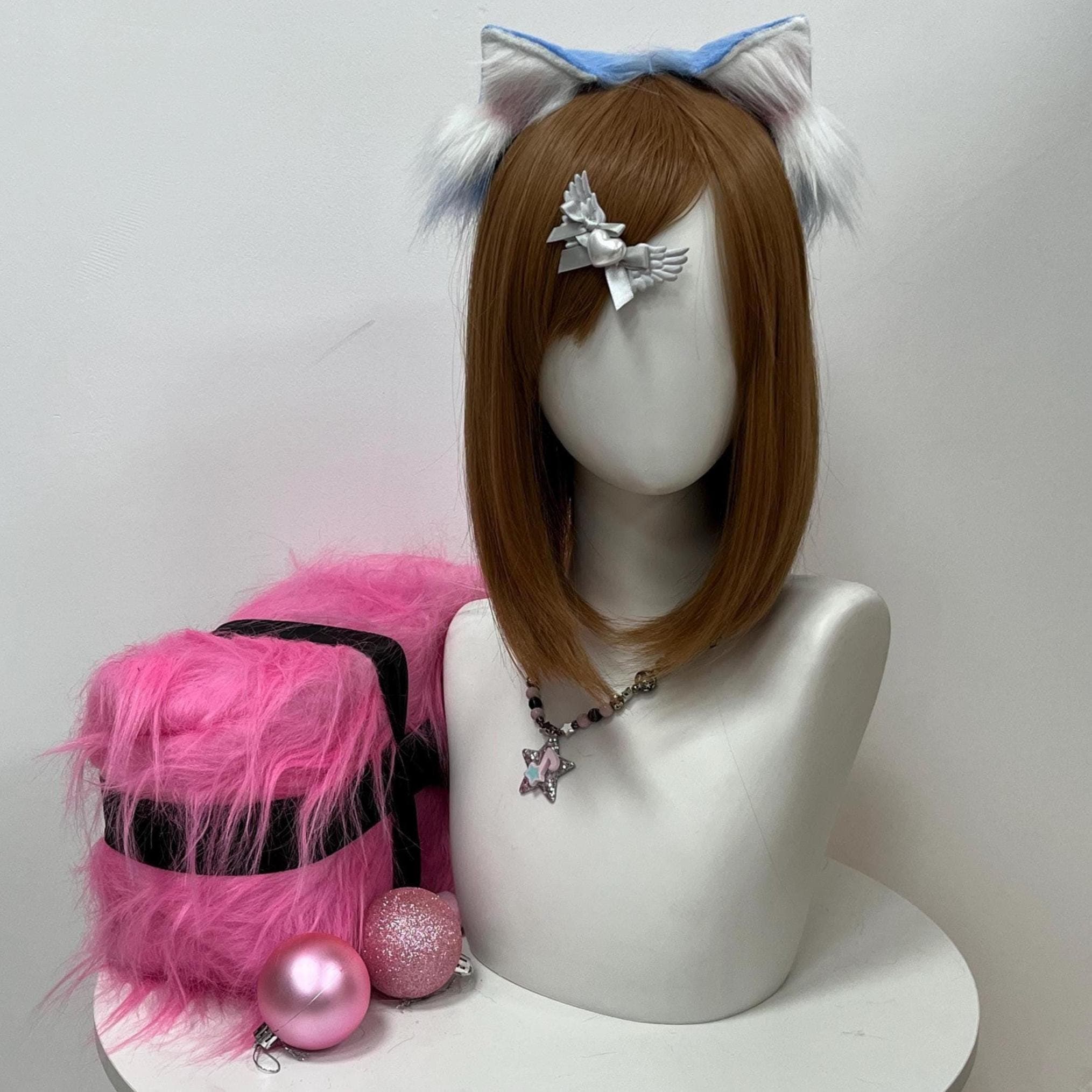 Front display showing how the cerulean sky wolf ears sit high on the crown, framing the wearer with an icy pale-blue silhouette and snowy ivory inner fluff streaked with blush pink at the root. The shaped faux fur arches symmetrically across the headband so the ears point skyward, delivering a convention-ready timberwolf look built for furry fandom gatherings, therian wear, cosplay photoshoots, and wintery wolf-spirit costume reveals at anime cons.