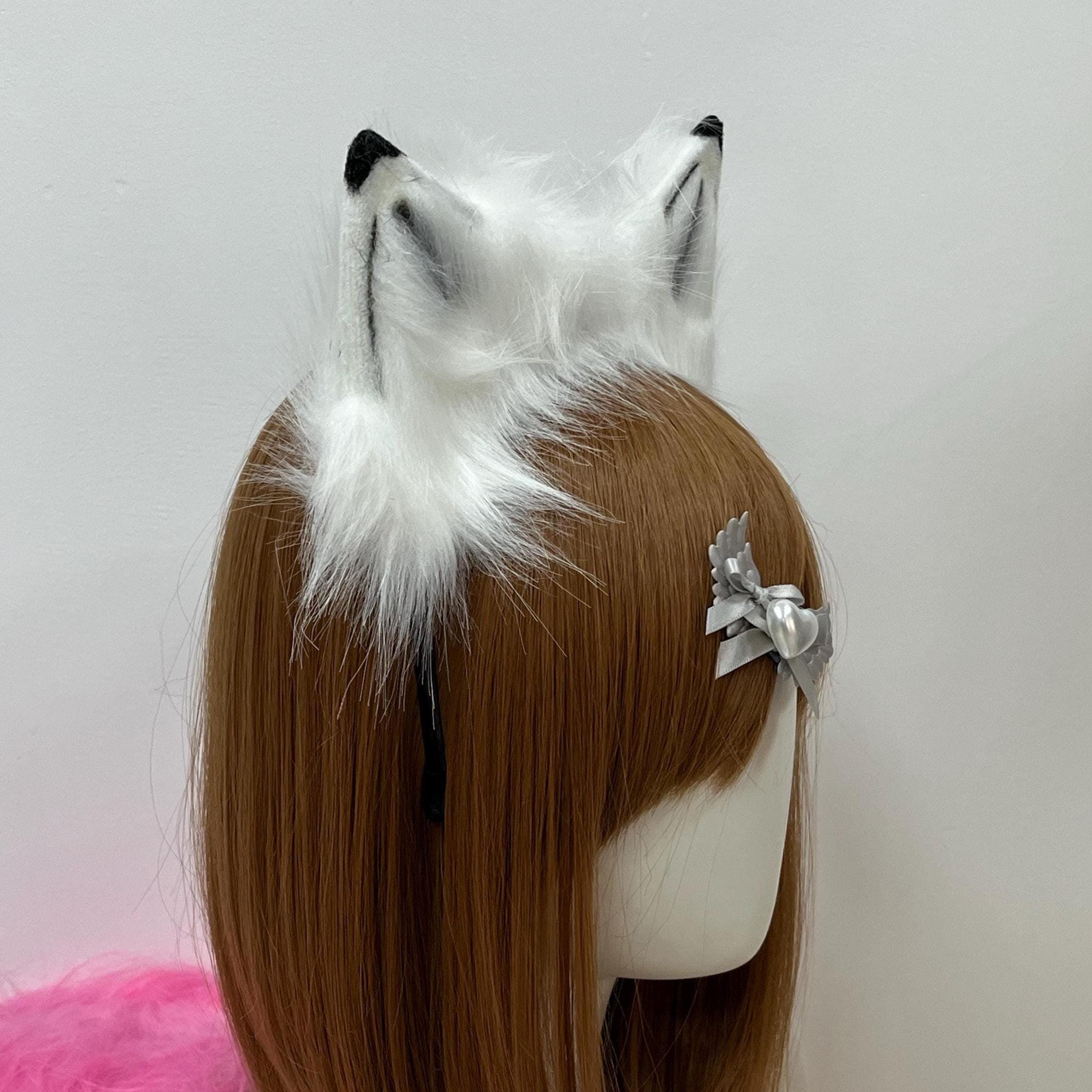 Close back angle reveals the inside of the wolf ears, showing how white guard hairs flow outward while charcoal striping defines the inner ear cavity for a strikingly real lupine effect. Each ear is shaped by careful hand from durable faux fur, giving the wolfear headband an authentic standing posture. A favorite among furry artists, therian crafters, larp performers, festival regulars, and costal wolf cosplayers building immersive convention looks.