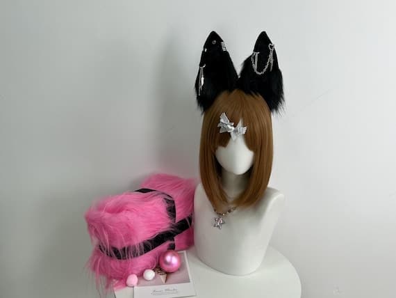 "Model wearing the handmade fox ears headband, perfectly complementing a full cosplay costume. The fox ears are attached to a comfortable black headband, with vibrant faux fur in shades of orange and white. This image shows the ears in action at a convention, highlighting their realistic appearance and fit."