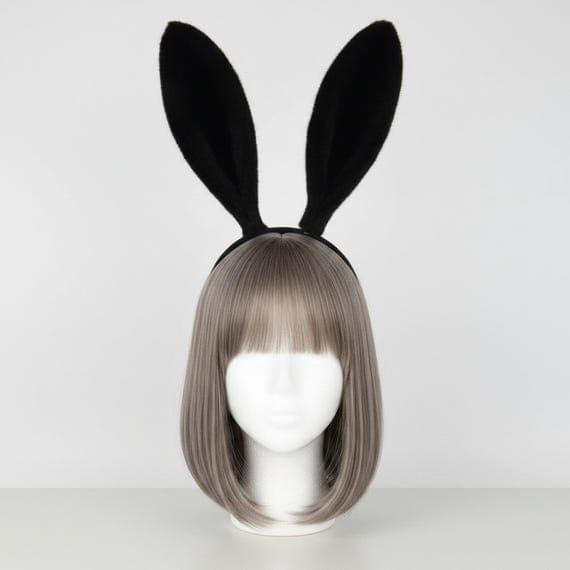 Classic plush rabbit ears headband in rich solid black displayed on a mannequin head with styled wig. Extra tall 24cm dense fluffy faux fur bunny ears on a comfortable padded black headband weighing 65g. Full-size rabbit costume accessory with luxuriously thick plush texture perfect for Halloween bunny costumes, cosplay conventions, anime events, Easter celebrations, themed parties, dramatic photo shoots, and festival outfits. Also available in grey, white-pink, and pink color options