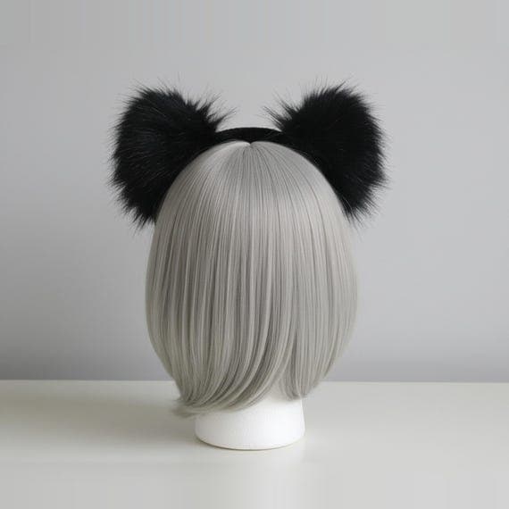 Rear view of kawaii black faux fur cat ear headband showing fur-wrapped headband and plush ear backs on a mannequin head with ash blonde bob wig, back view of kawaii cat ears cosplay neko ears headband against neutral grey studio background