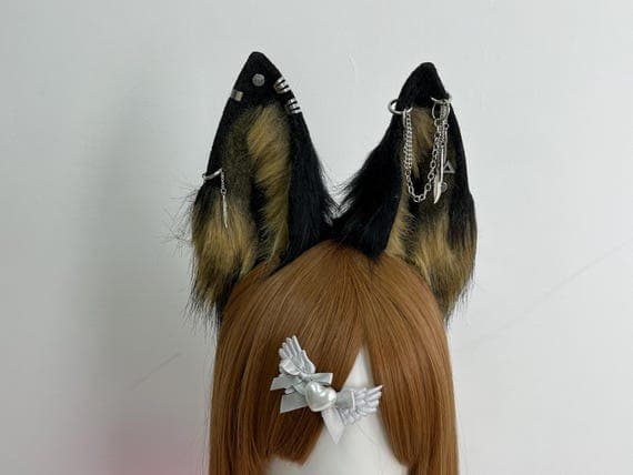 Realistic handmade wolf ears headband for cosplay and Halloween costumes. These fluffy, black-gray ears are designed with attention to detail, giving a lifelike appearance for furry enthusiasts and animal lovers. Perfect for completing your wolf or fox-themed costume, this accessory is ideal for cosplay parties, pet play, or themed events. Made from high-quality faux fur, the large, colorful ears feature soft inner layers and sturdy headband design for comfort during all-day wear kid adults