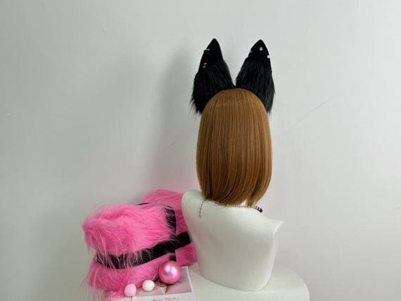 "Close-up shot highlighting the detailed faux fur texture of the handmade fox cosplay ears. The vibrant orange and white fur creates a realistic animal ear look, ideal for cosplay enthusiasts and furry events. The fur is soft, fluffy, and designed to resemble a fox’s natural ears for a lifelike appearance."