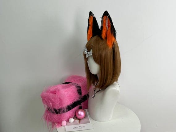 High-quality handmade wolf ears headband in vibrant orange and deep black faux fur, ideal for cosplay, fursuit light looks, Halloween costumes, and character roleplay. These custom wolf ears are attached to a black headband for secure fit and realism. Designed with cosplay photographers, performers, and furry community members in mind. A must-have cosplay accessory for those creating wolf-inspired characters.
