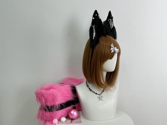 "Side view of realistic wolf ears made from high-quality faux fur in black, grey, and white tones, attached to a sturdy black headband. These ears are designed to look like a wild wolf's ears, offering a natural appearance with fur that mimics real animal textures. Ideal for cosplay, furry events, and Halloween costumes."