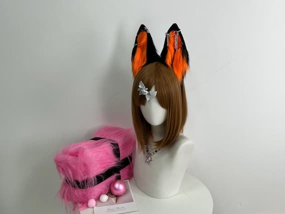 Handmade orange and black wolf ears headband made with realistic faux fur, perfect for cosplay costumes, furry conventions, Halloween outfits, and animal-themed events. Custom cosplay wolf ears for adults and teens, designed for comfort and style. This cosplay accessory features a durable headband and fluffy faux fur construction. Ideal for Halloween cosplay or furry fashion fans looking for unique wolf-themed accessories.