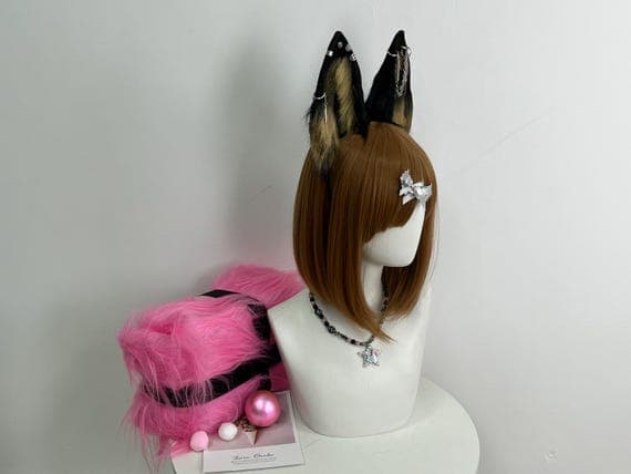 Fluffy, realistic wolf ears headband with a black and brown color scheme for cosplay or furry play. These handmade, two-tone faux fur ears are designed to provide a lifelike and comfortable accessory for any animal-themed costume. Ideal for cosplay events, Halloween parties, or even a unique addition to your snowboarding or skiing outfit, these ears are sure to make you stand out. Safe for all ages, these large ears are perfect for both kids and adults animal-themed characters  life