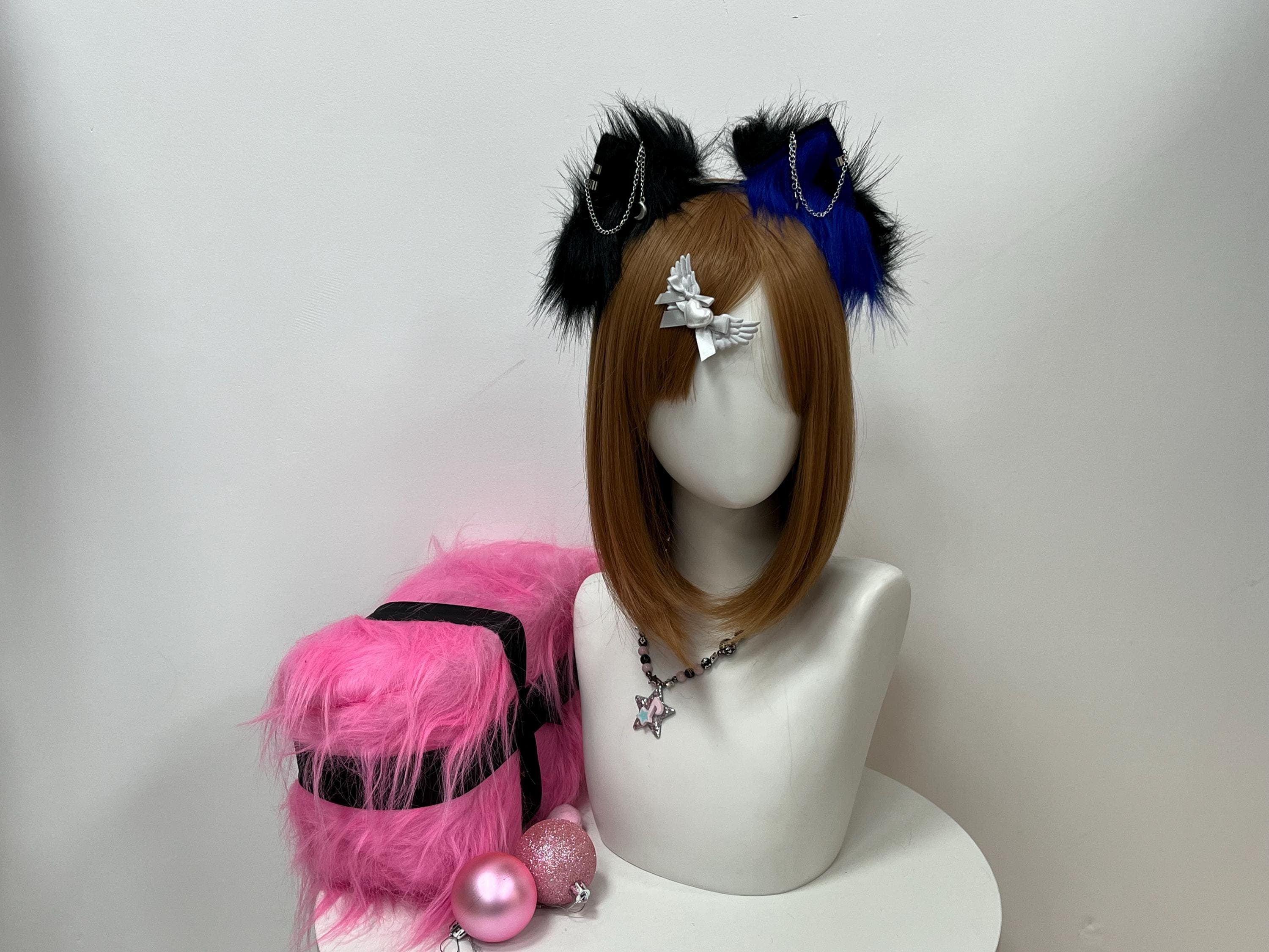 Front display of the black and royal blue wolf ears headband catching overhead studio light, with one inky midnight ear mirrored by a deep sapphire twin for striking dual-tone energy. Delicate silver chain accents trail across the soft faux fur tufts, a subtle armor glint fans love for con photos. A standout centerpiece for therian fits, kemonomimi builds, or moody timberwolf OCs heading to furry meets, anime convention floors, or outdoor festival lineups under string lights.
