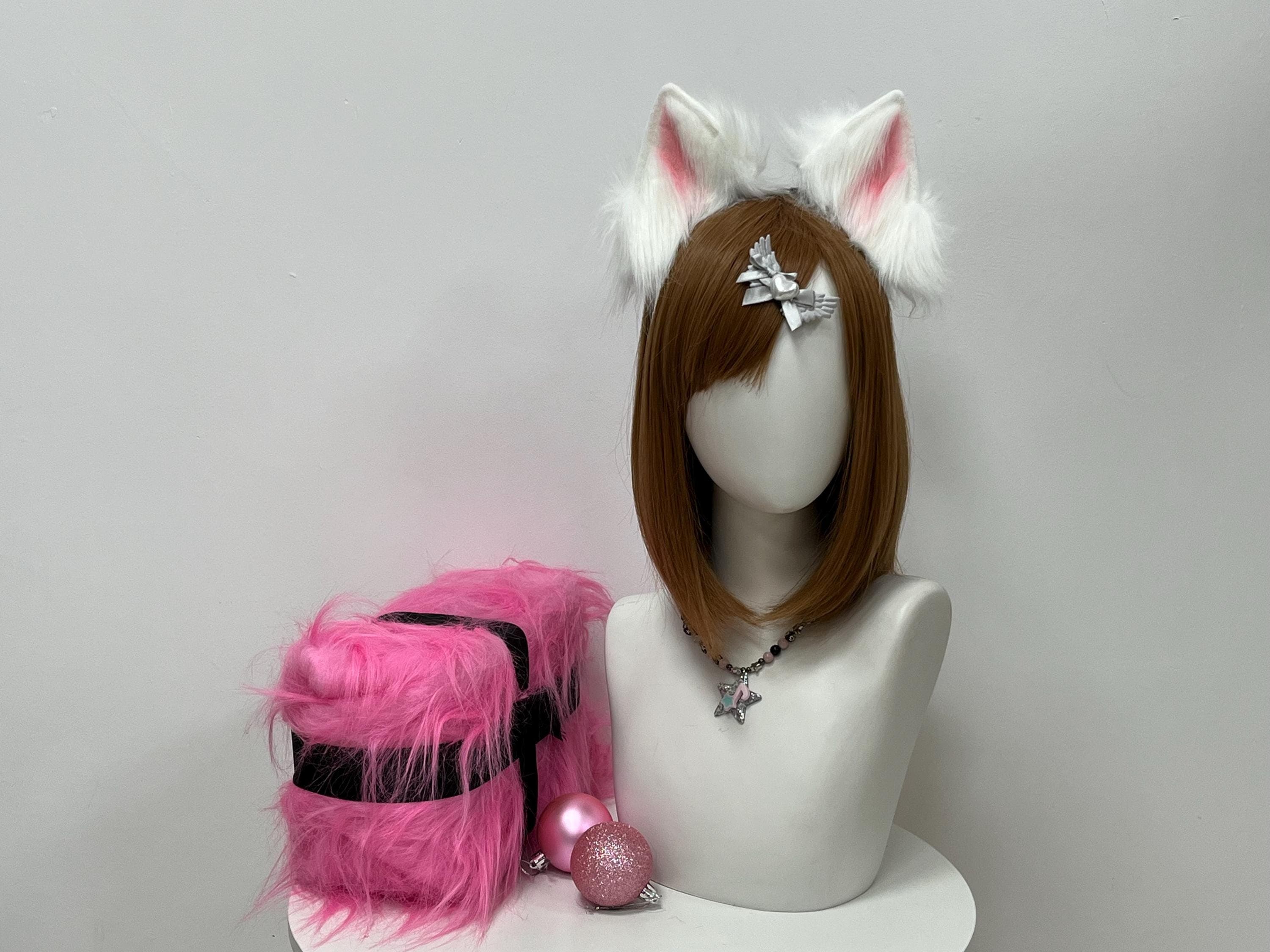 Handmade white faux fur cat ears headband shown front view, featuring tall pointed realistic kitty ear shape with snow pearl outer fur and soft blush pink inner panels for a gentle contrast. Perfect kemonomimi accessory for anime cosplay looks, Halloween costume parties, catgirl fursona builds, bridal photoshoots, and LARP angel characters. Lightweight comfy headband stays put all day and makes an instant statement at any con with that sweet alert feline silhouette above the crown.