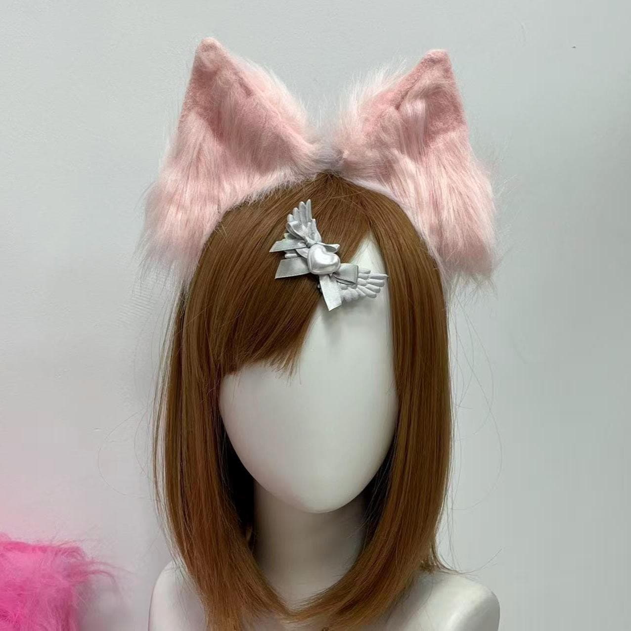 Realistic blush faux fur wolf ears headband shaped with tall triangular shells and lightly feathered tips, sitting pretty in a soft blush-rose colorway reading pure kemonomimi as soon as you snap it into place. Dusty pink fluff sweeps into cream-pale highlights across the crown of each ear for an angelic neko-girl finish, gliding cleanly into magical girl sets, maid cafe photoshoots, himekaji OC concepts, or a dreamy pastel con hallway day fit worth snapping for your feed.