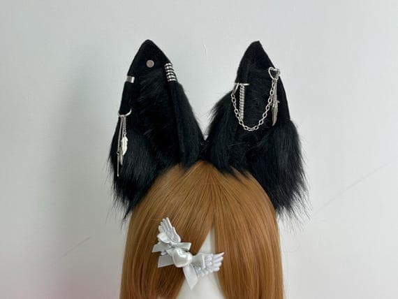 "Wolf ears headband displayed with a complete costume ensemble, featuring realistic grey and black faux fur. The soft, natural-looking fur on the ears gives the appearance of a wild wolf, making it perfect for cosplay, Halloween, or themed parties. The headband is comfortable and adjustable for different head sizes."